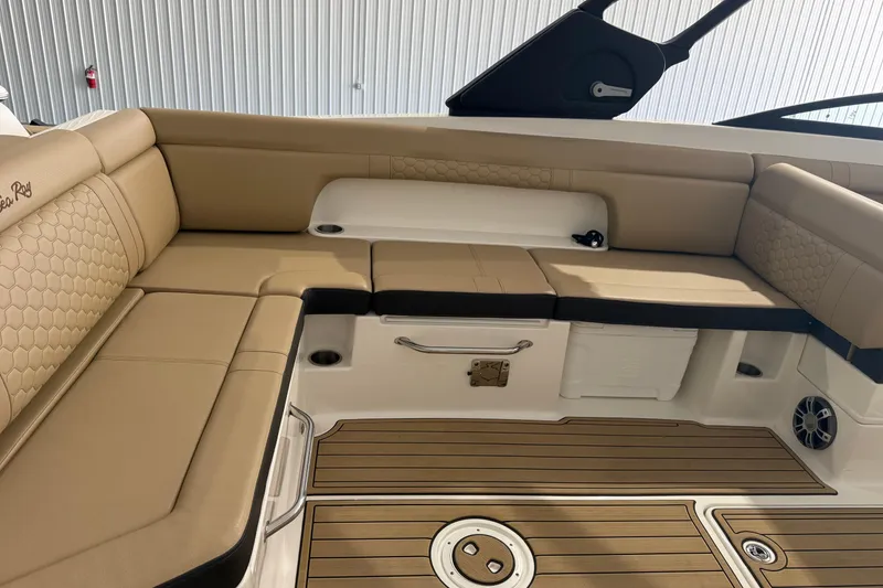 Slide: The Image of Luxurious seating area on 2023 Sea Ray SDX 290 boat with tan upholstery and wood flooring. - 5