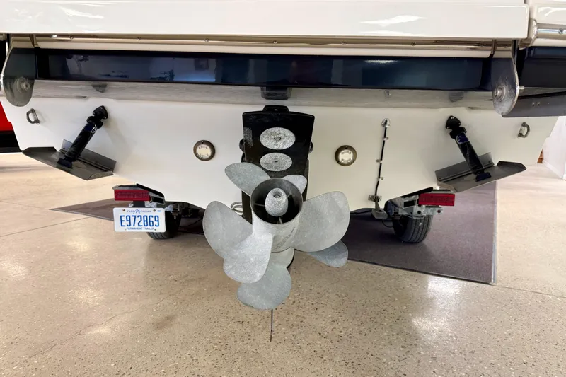 Slide: The Image of Rear view of 2023 Sea Ray SDX 290 boat showing propeller and license plate. - 8