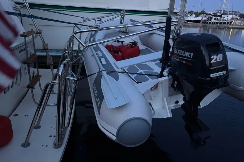 Slide: The Image of 1987 Chris-Craft 427 Catalina with Suzuki 20 outboard motor at marina. - 10