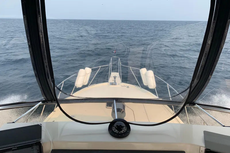 Slide: The Image of 1987 Chris-Craft 427 Catalina cruising on open sea, view from helm. - 21
