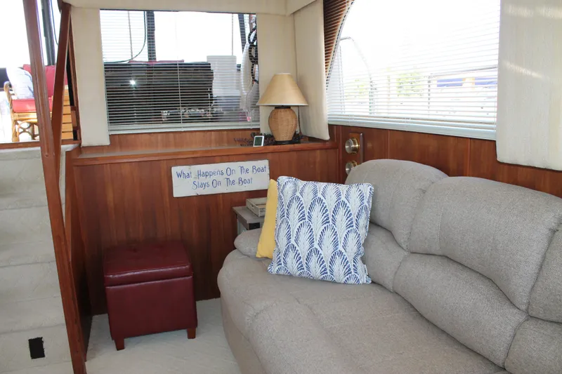 Slide: The Image of Interior of 1987 Chris-Craft 427 Catalina with cozy seating and nautical decor. - 30