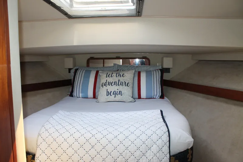 Slide: The Image of Cozy bedroom in 1987 Chris-Craft 427 Catalina yacht with nautical-themed bedding. - 35
