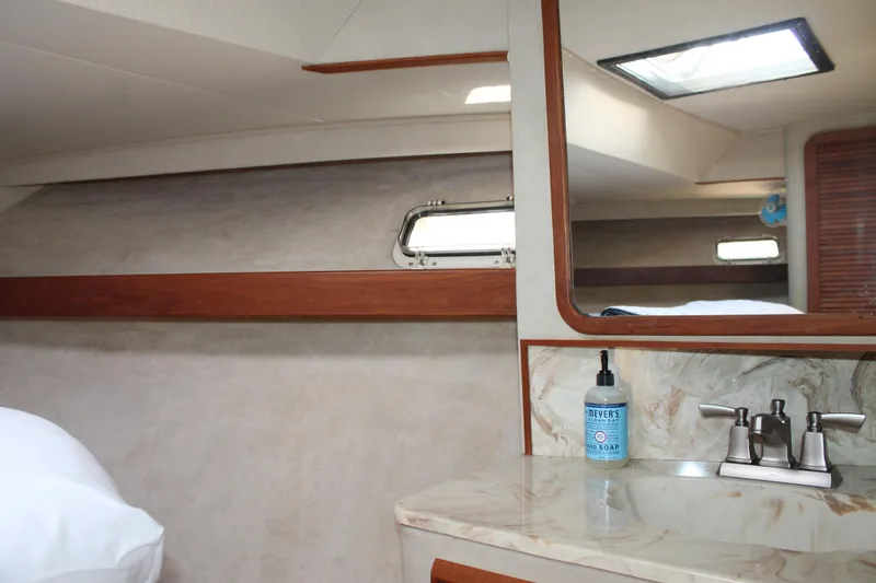 Slide: The Image of Interior of 1987 Chris-Craft 427 Catalina yacht with sink and mirror. - 37