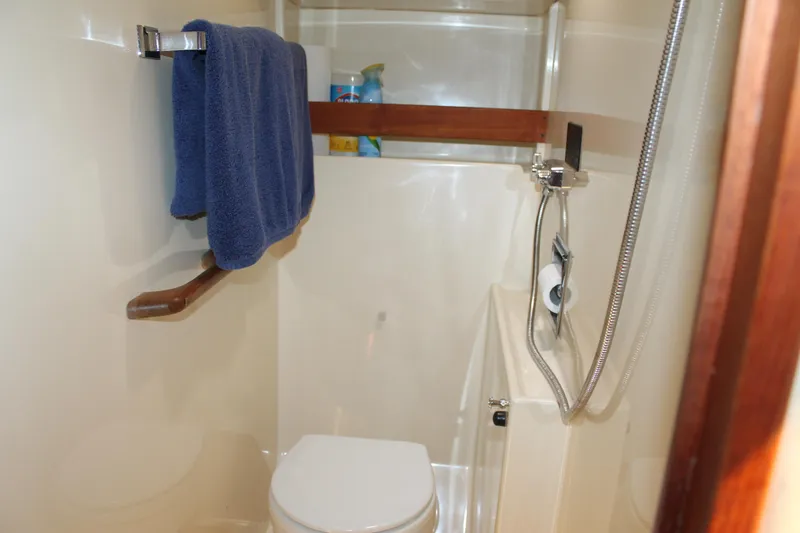 Slide: The Image of Bathroom interior of 1987 Chris-Craft 427 Catalina yacht with shower and towel rack. - 38