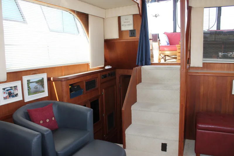 Slide: The Image of Interior of 1987 Chris-Craft 427 Catalina yacht with cozy seating and elegant wood paneling. - 40