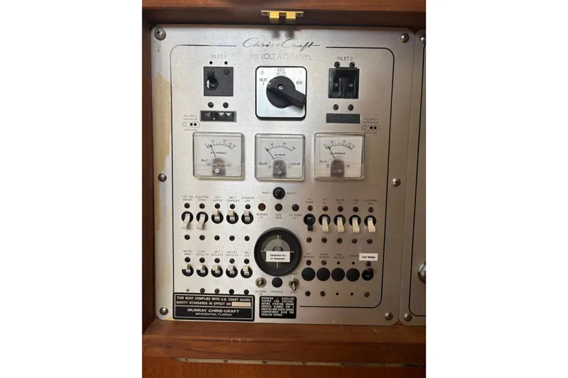 Slide: The Image of Control panel of 1987 Chris-Craft 426 Catalina boat with switches and gauges. - 46