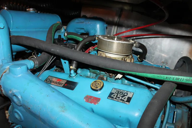 Slide: The Image of Engine room of 1987 Chris-Craft 427 Catalina with visible machinery and wiring. - 48