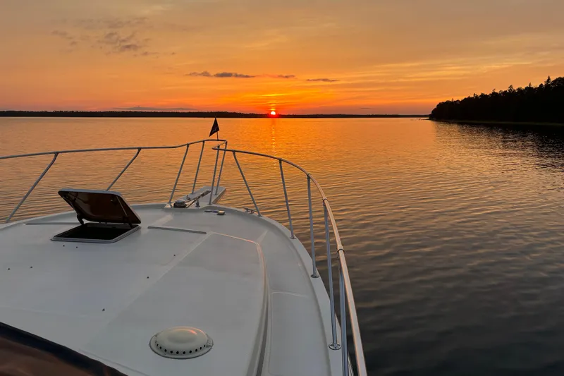 Slide: The Image of Chris-Craft 427 Catalina yacht at sunset on calm waters, 1987 model. - 5
