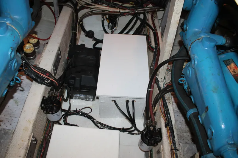 Slide: The Image of Engine compartment of 1987 Chris-Craft 427 Catalina, showcasing wiring and components. - 51