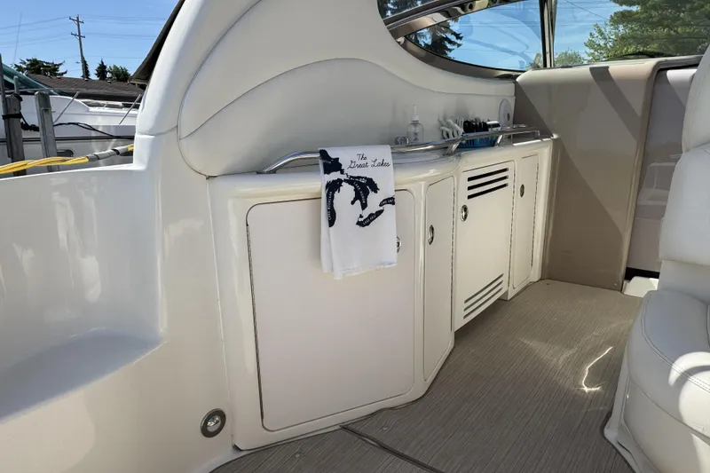 Slide: The Image of Interior of 2002 Sea Ray 360 Sundancer yacht with kitchenette and towel. - 11