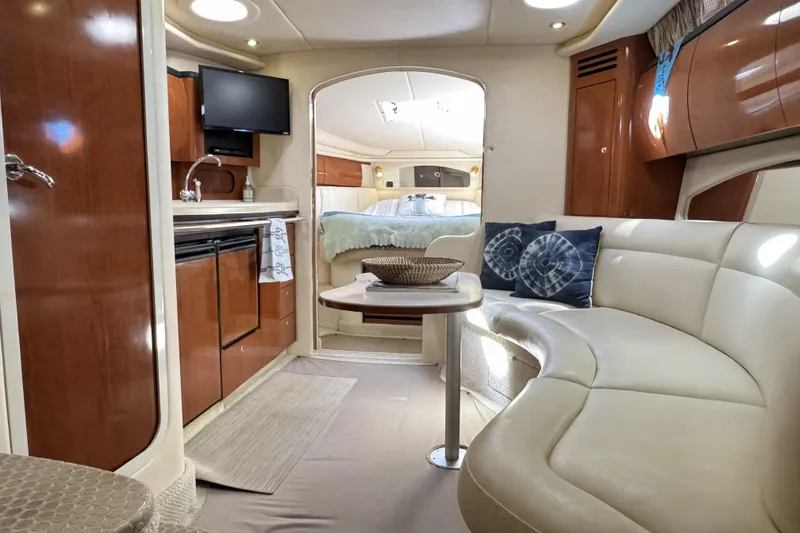 Slide: The Image of Luxurious interior of a 2002 Sea Ray 360 Sundancer yacht with elegant seating and modern amenities. - 17