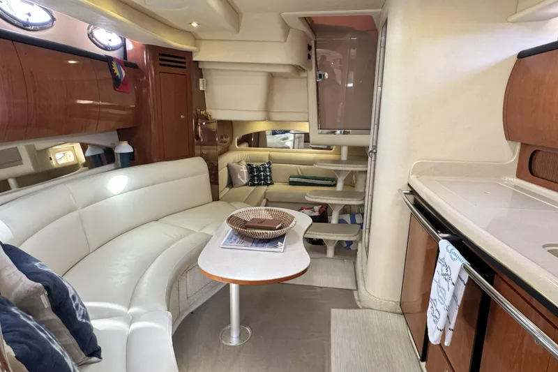 Slide: The Image of Interior of 2002 Sea Ray 360 Sundancer yacht with elegant seating and kitchenette. - 18