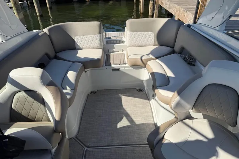 Slide: The Image of 2022 Crownline 265 SS boat interior with luxurious seating and elegant design. - 4