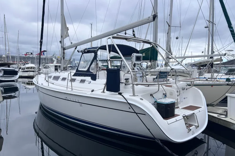 The Image of 2006 Hunter 38 sailboat docked in marina. - 0
