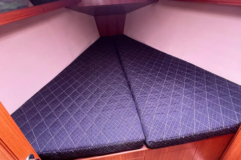 Slide: The Image of Interior of a 2006 Hunter 38 yacht with V-shaped berth. - 23