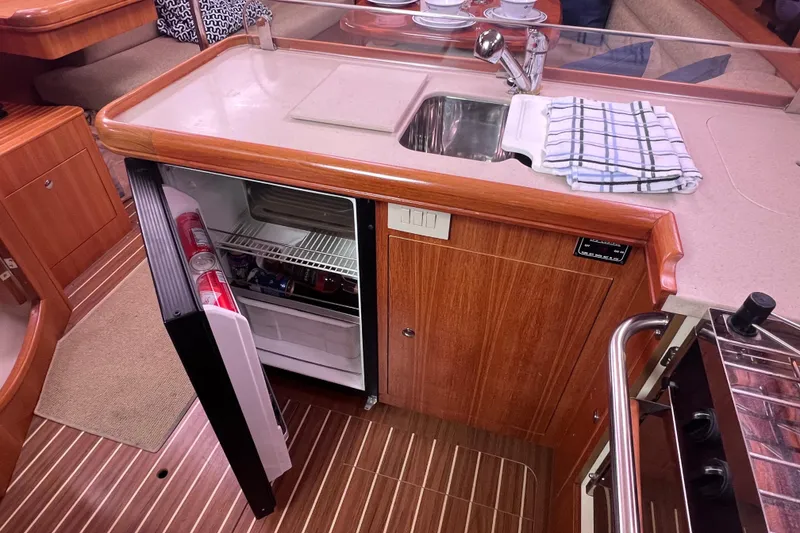 Slide: The Image of Galley area of a 2006 Hunter 38 yacht with fridge and sink. - 27