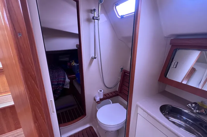 Slide: The Image of Interior of a Hunter 38 yacht, bathroom with shower and toilet. - 31