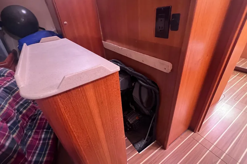 Slide: The Image of Interior of a 2006 Hunter 38 sailboat with wood paneling. - 32