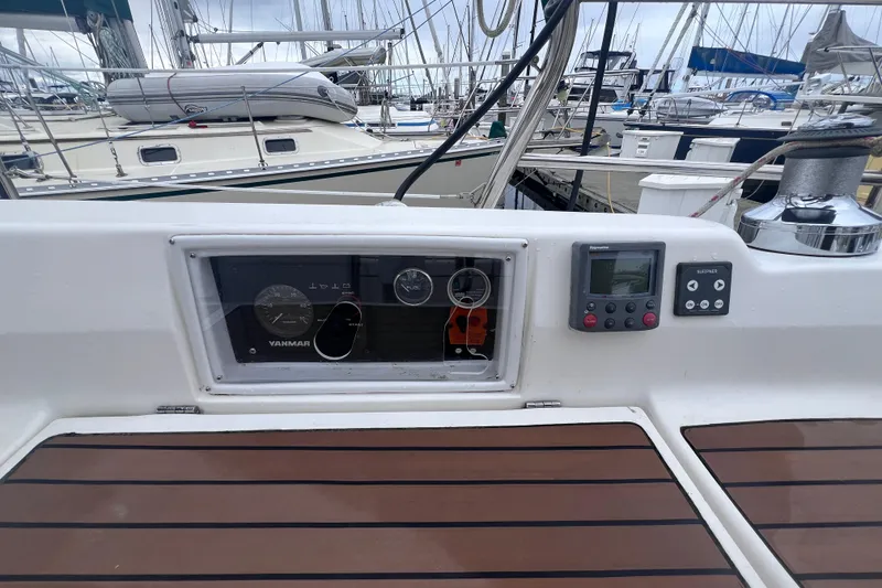 Slide: The Image of Control panel of a 2006 Hunter 38 yacht in a marina. - 7