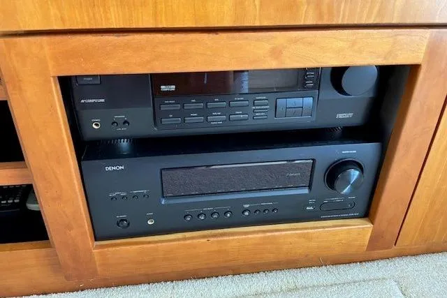 Slide: The Image of Audio equipment in a 2000 Silverton 41 Convertible yacht's wooden cabinet. - 24