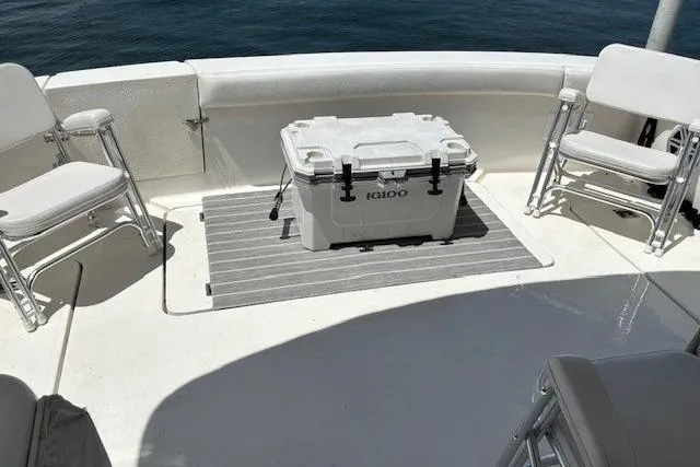 Slide: The Image of Boat deck of 2000 Silverton 41 Convertible with chairs and Igloo cooler. - 25