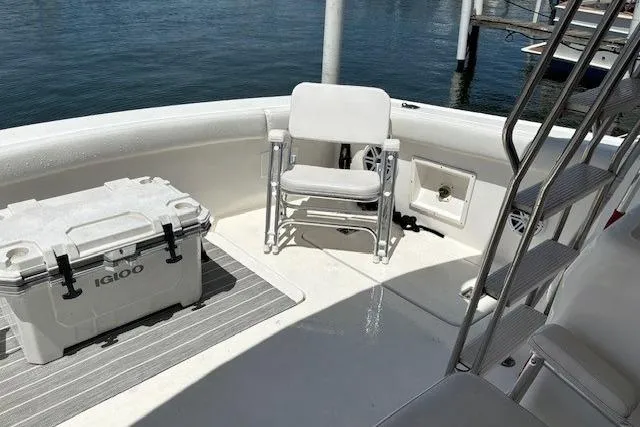 Slide: The Image of 2000 Silverton 41 Convertible boat deck with chair and Igloo cooler. - 26