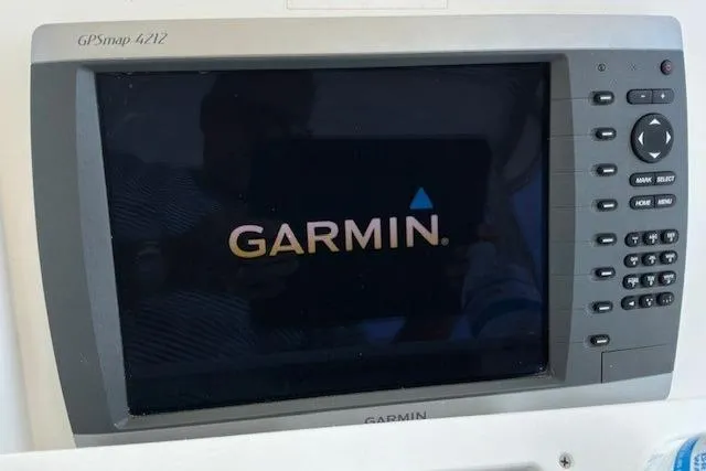 Slide: The Image of Garmin GPSmap 4212 navigation system on 2000 Silverton 41 Convertible boat. - 32