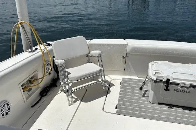 Slide: The Image of 2000 Silverton 41 Convertible boat deck with chair and Igloo cooler. - 34