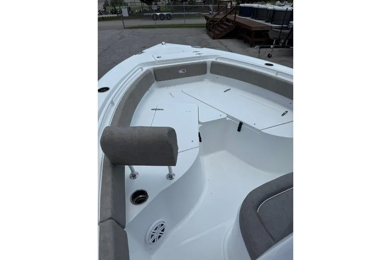 Slide: The Image of 2026 Sea Hunt Ultra 235 SE boat interior with cushioned seating and storage compartments. - 12