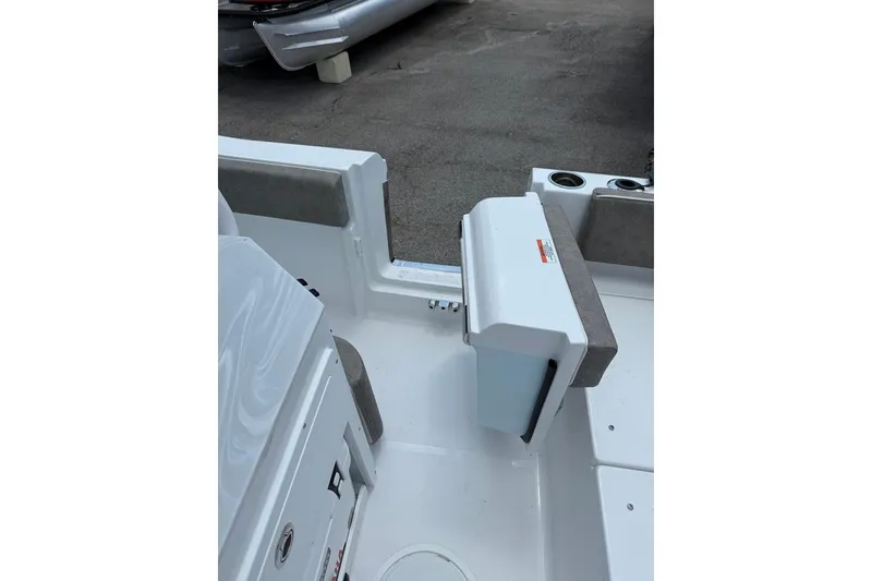 Slide: The Image of 2026 Sea Hunt Ultra 235 SE boat interior, featuring seating and storage compartments. - 4