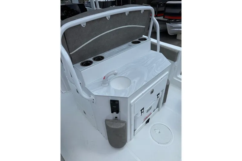Slide: The Image of 2026 Sea Hunt Ultra 235 SE boat interior with seating and storage features. - 5