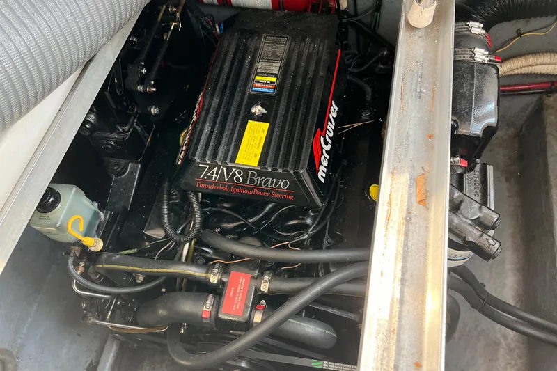 Slide: The Image of Engine compartment of a 1997 Sea Ray 270 Sundancer with MerCruiser 7.4L V8 Bravo engine. - 10