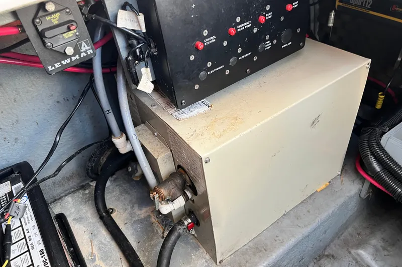Slide: The Image of Electrical components inside a 1997 Sea Ray 270 Sundancer boat. - 11