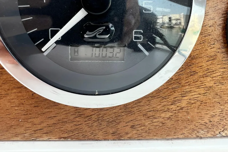 Slide: The Image of Close-up of a 1997 Sea Ray 270 Sundancer boat gauge displaying 100.2 hours. - 19