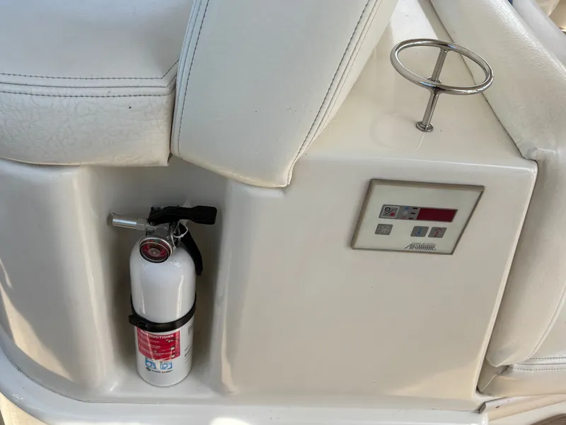 Slide: The Image of Fire extinguisher and controls on 2000 Sea Ray Sundancer 460. - 14