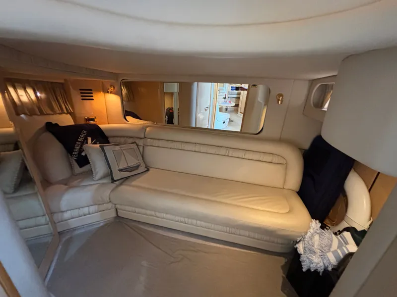 Slide: The Image of Interior of 2000 Sea Ray Sundancer 460 yacht with beige sofa. - 21