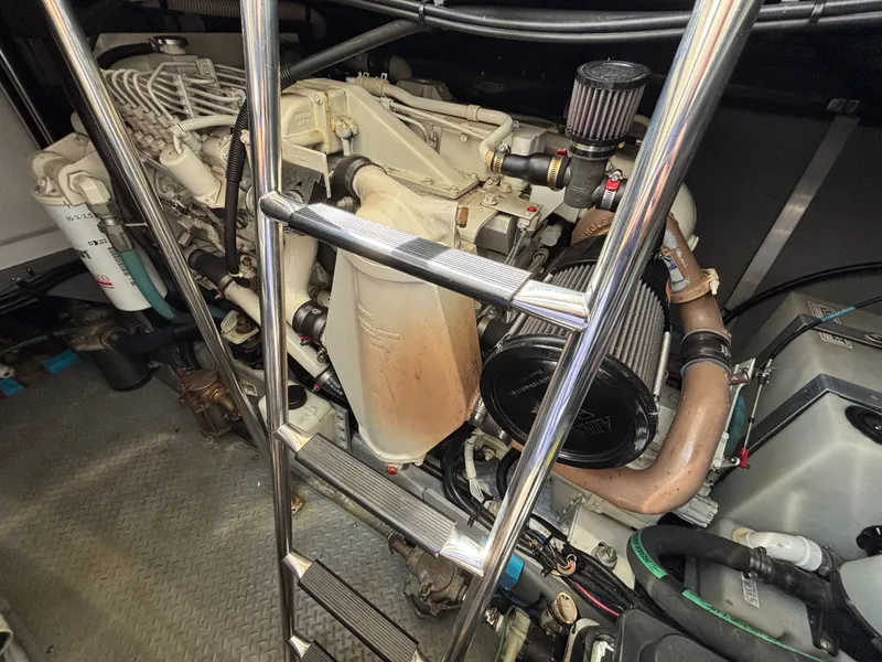 Slide: The Image of Engine room of 2000 Sea Ray Sundancer 460 with ladders. - 26