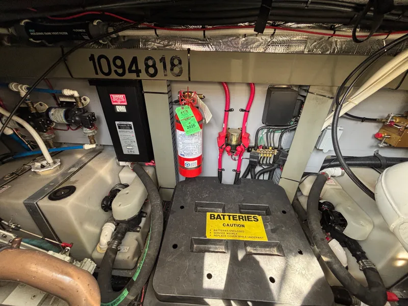 Slide: The Image of Engine room of 2000 Sea Ray Sundancer 460 with fire extinguisher and battery compartment. - 28