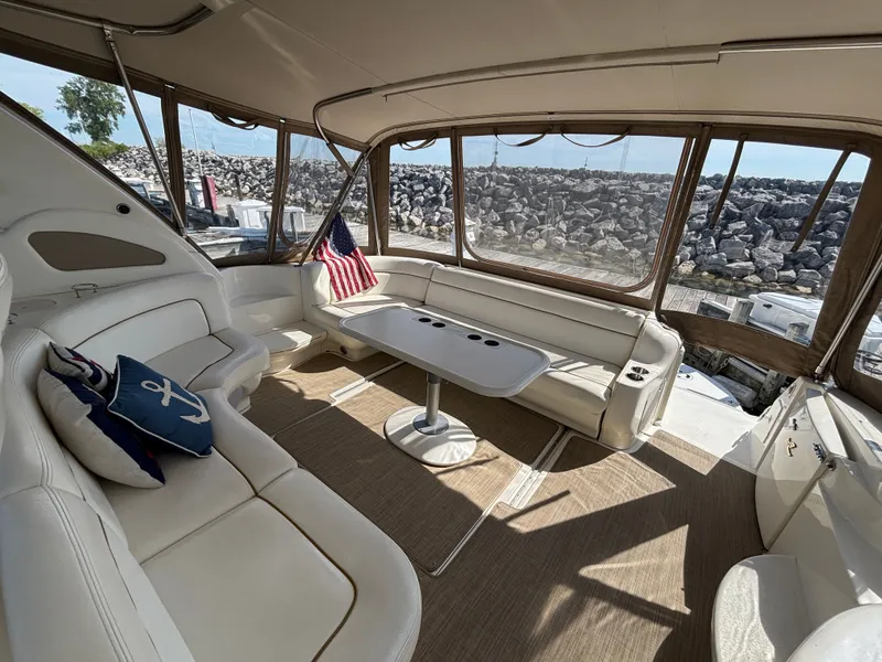 Slide: The Image of Interior of a 2000 Sea Ray Sundancer 460 yacht with elegant seating area. - 5