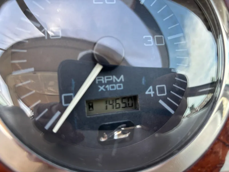 Slide: The Image of Tachometer of a 2000 Sea Ray Sundancer 460 showing 1465.01 RPM. - 8
