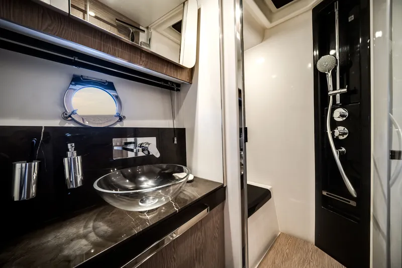 Slide: The Image of Luxurious bathroom with glass sink and modern shower on an Azimut S6 yacht. - 53