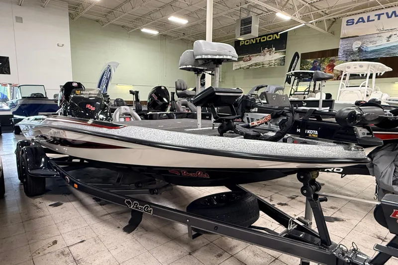 Slide: The Image of 2018 Bass Cat Lynx boat displayed indoors, featuring advanced fishing equipment and sleek design. - 1