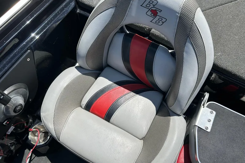 Slide: The Image of 2018 Bass Cat Lynx boat seat with red, black, and gray design. - 10
