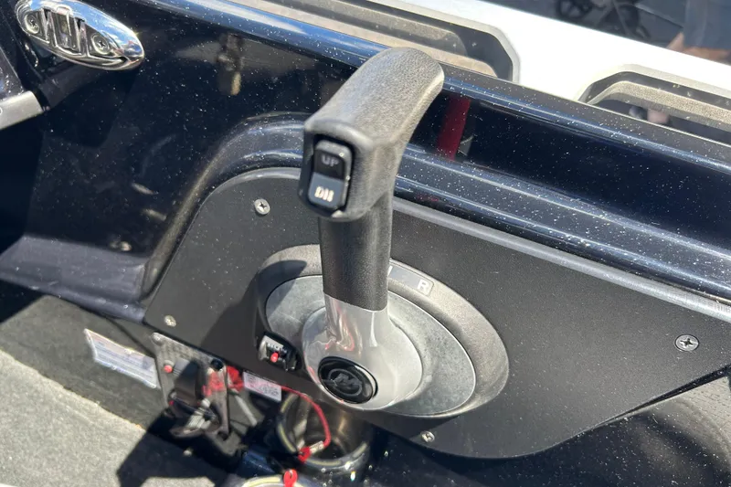 Slide: The Image of 2018 Bass Cat Lynx boat throttle control lever in cockpit. - 13