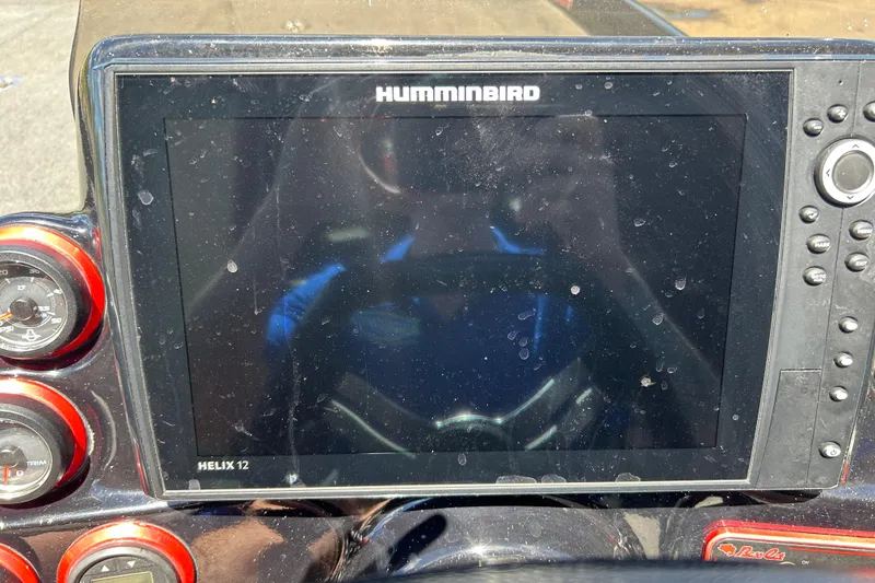 Slide: The Image of Humminbird Helix 12 fishfinder on 2018 Bass Cat Lynx dashboard, with gauges and controls. - 14