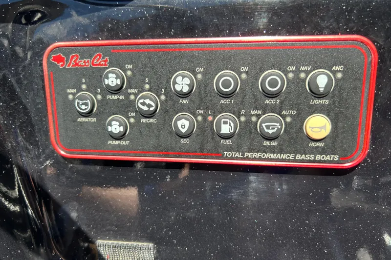 Slide: The Image of Control panel of a 2018 Bass Cat Lynx boat with various function buttons. - 15