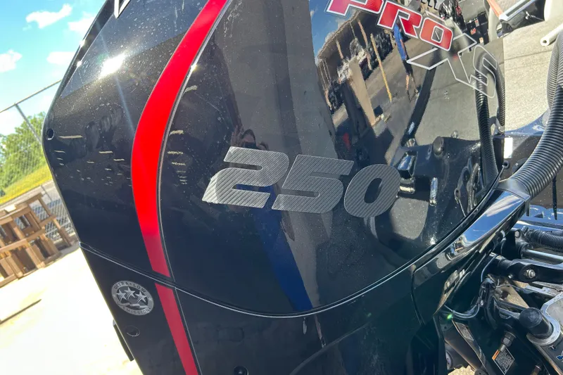 Slide: The Image of Close-up of a 2018 Bass Cat Lynx boat engine with "250 Pro XS" branding. - 22