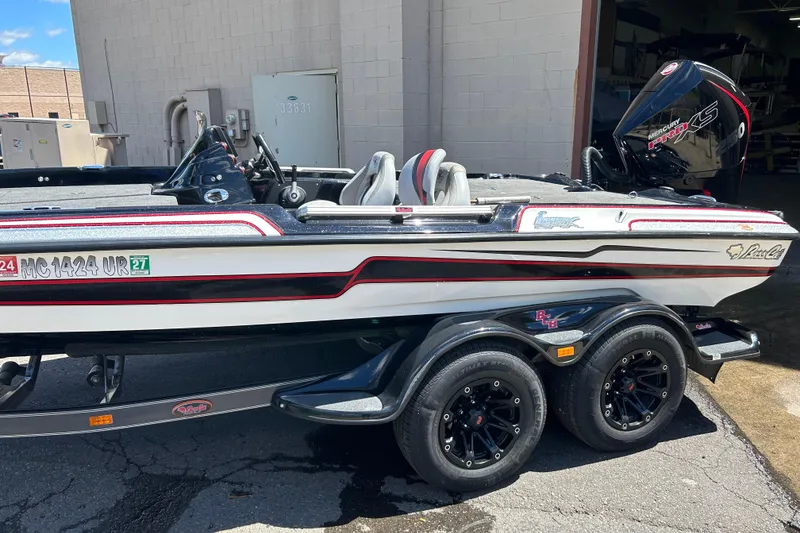 Slide: The Image of 2018 Bass Cat Lynx boat with Mercury Pro XS engine on a trailer. - 7