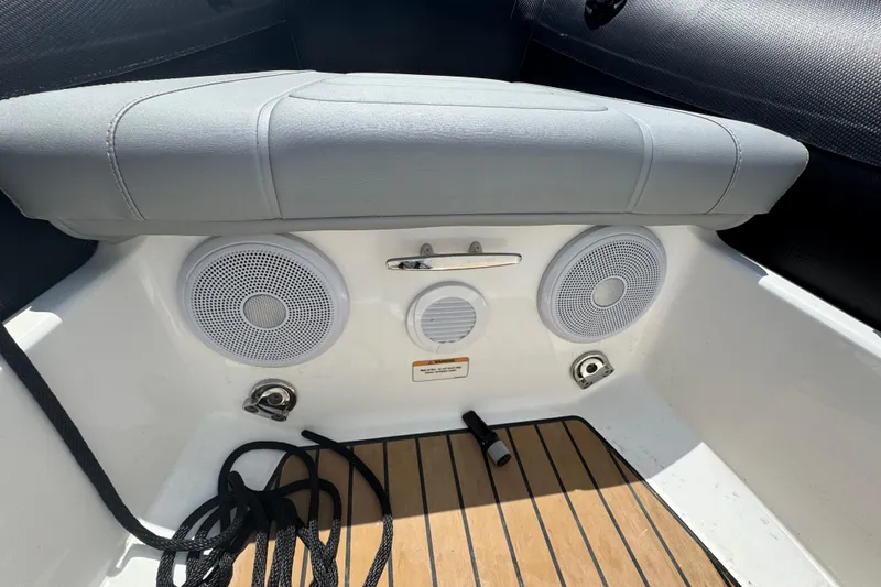 Slide: The Image of 2025 Williams Jet Tenders Sportjet 345 interior with speakers and teak flooring. - 15