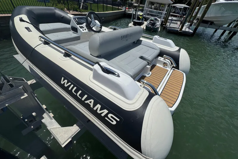 Slide: The Image of 2025 Williams Jet Tenders Sportjet 345 docked, showcasing sleek design and modern features. - 4